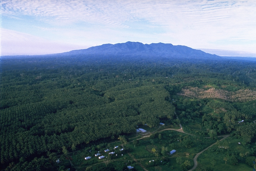 Mount Balbi is seen here from the village of Wakunai, E of the volcano along the NE coast of Bougainville Island. Balbi is the largest volcano on the island and has a NW-SE-trending chain of vents. Photo by Wally Johnson, 1987 (Australia Bureau of Mineral Resources).