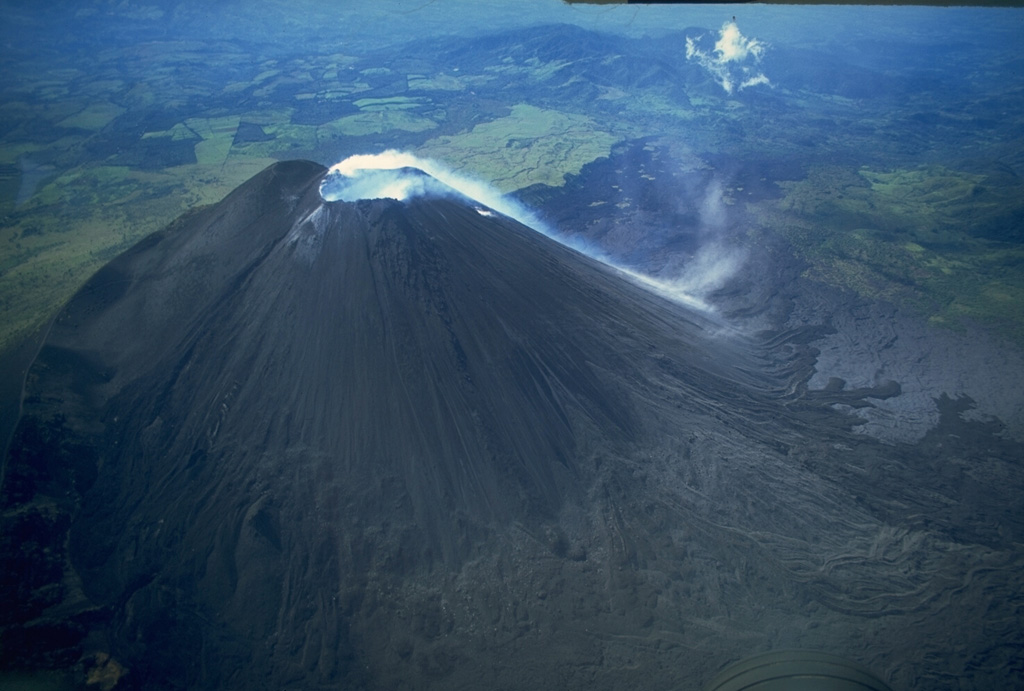 Gas emissions from the summit crater of the MacKenney cone of Pacaya descends its SW flank in this 10 November 1994 photo. Powerful explosions during 7-10 March 1989 that destroyed the upper 75 m of MacKenney cone, after which Strombolian activity resumed in early January 1990. Copyrighted photo by Stephen O'Meara, 1994.