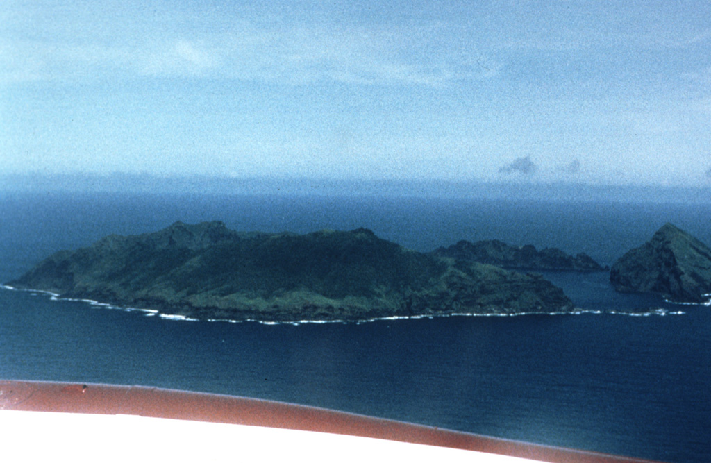An aerial view of the Maug Islands from the NE shows Kitashima (North Island) at the right margin, Higashishima (East Island) in the foreground, and Nishishima (West Island) in the background. The islands enclose a 2.5-km-wide submarine caldera containing a lava dome that rises to within about 20 m of the ocean surface.  Photo by Dick Moore, 1990 (U. S. Geological Survey).