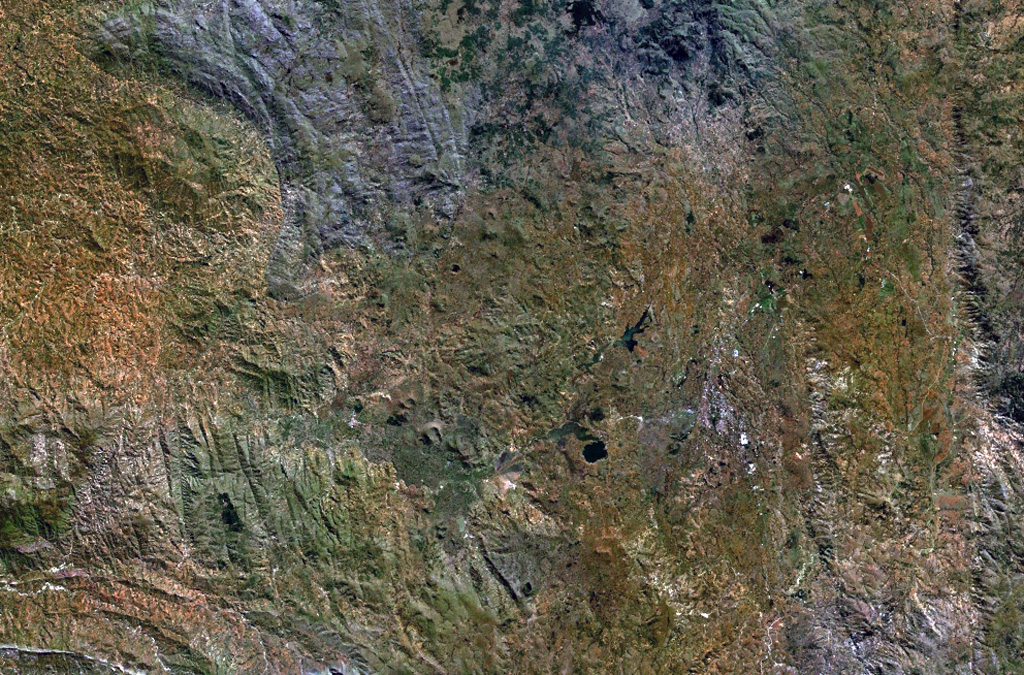 The Ankaratra volcanic field in central Madagascar consists of lava domes, fissure vents, scoria cones, and maars. The volcanic field is one of the largest on the island and covers a 100-km-long area in central Madagascar. Hot springs occur at Ranomafana. N is at the top in this NASA Landsat image. NASA Landsat 7 image (worldwind.arc.nasa.gov)