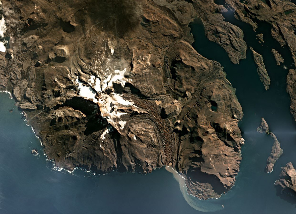 The Kerguelen Islands are part of an extensive Large Igneous Province, and are composed largely of extensive lava flows, exposed intrusive rock, and several volcanic centers such as Mount Ross which is shown in this April 2019 Planet Labs satellite image monthly mosaic (N is at the top; this image is approximately 30 km across). The Buffon glacier is on the eastern flank and immediately E of where it turns S is the flat-topped remnant of a lava lake. Satellite image courtesy of Planet Labs Inc., 2019 (https://www.planet.com/).