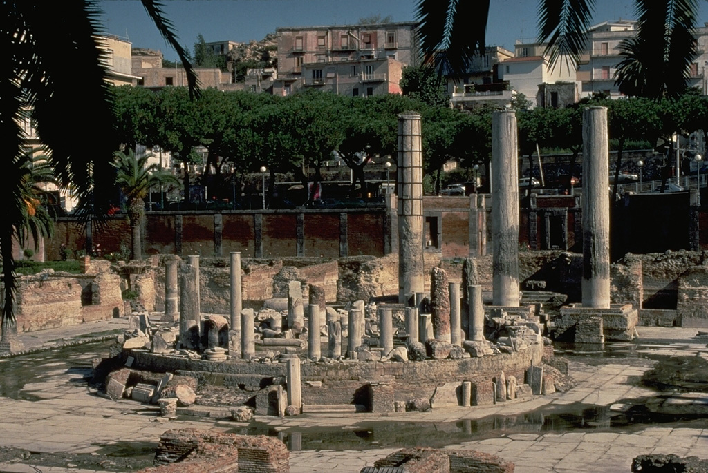 The famous pillars of the Roman temple of Seraphis, in Pozzuoli, have served as unintended markers of periodic uplift of the Campi Flegrei caldera floor.  Borings in the marble columns by marine organisms show that the location had sunk 11 m below sea level by 1000 CE and then rose 12 m by 1538, including rapid uplift of 4 m immediately prior to the 1538 eruption of Monte Nuovo.  More recent periods of rapid uplift took place in 1970-72 and 1982-84. Copyrighted photo by Katia and Maurice Krafft, 1988.