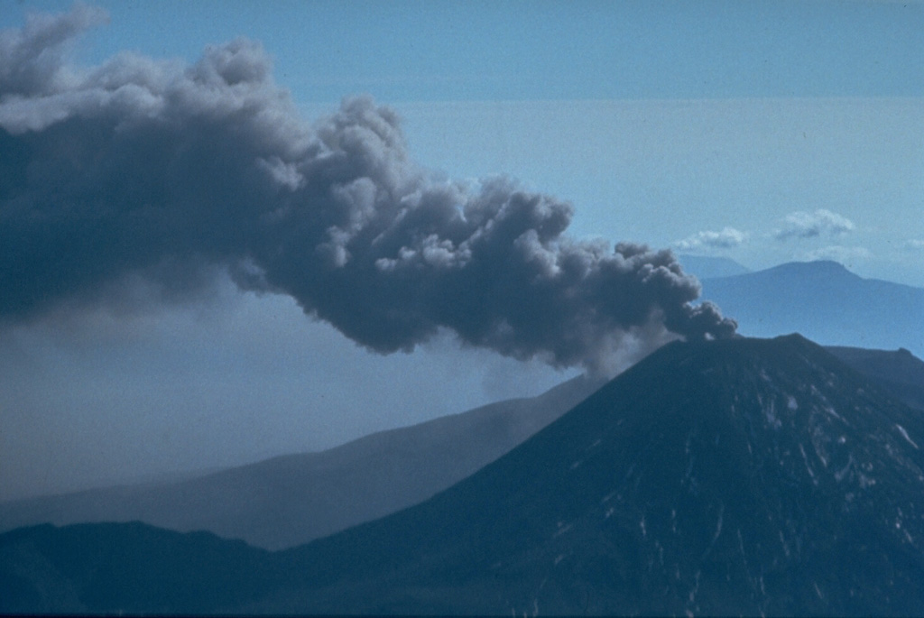 An ash plume on 29 March 1974, is directed by the wind from the summit of Ngauruhoe volcano one day after powerful explosions that were accompanied by pyroclastic flows. Intermittent explosive eruptions had been occurring since 22 November 1972 and continued until 19 August 1974. Eruptions in January and March 1974 were the largest in two decades from Ngauruhoe. Photo by Jim Cole, 1974 (University of Canterbury).