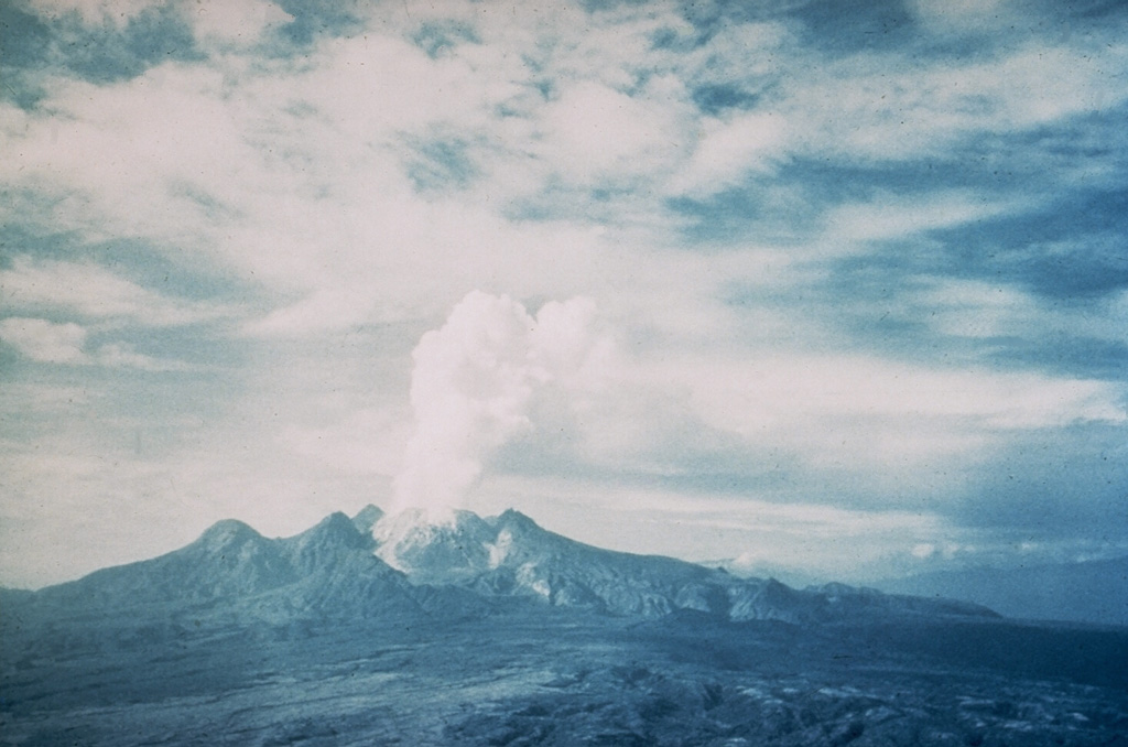 Mount Lamington, seen here from the north in late 1951, has a 1.3-km-wide summit crater containing a lava dome. Prior to its disastrous eruption in 1951, the forested peak had not been recognized as a volcano. The 1951 eruption produced pyroclastic flows and surges that devastated all sides of the volcano, killing nearly 3,000 people. The eruption concluded with growth of a 560-m-high lava dome in the summit crater. Photo by Tony Taylor, 1951 (courtesy of Wally Johnson, Australia Bureau of Mineral Resources).