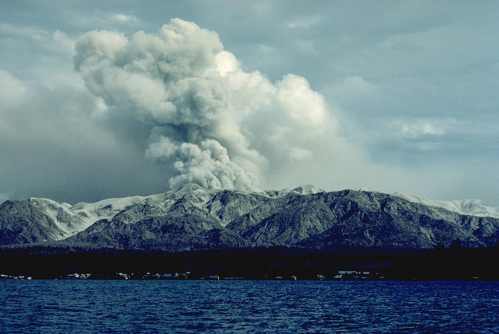 Colo volcano, seen here in eruption in September 1983, forms the isolated island of Una-Una in the Gulf of Tomini, northern Sulawesi.  The broad, low island is truncated by a 2-km-wide caldera.  Only three eruptions have taken place in historical time, but two of those, in 1898 and 1983, caused extensive devastation over much of the island. Copyrighted photo by Katia and Maurice Krafft, 1983.