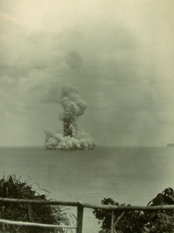 A submarine eruption from Anak Krakatau on 13 June 1930, produces both a vertical eruption plume and a base surge extending radially from the vent along the surface of the sea. Submarine eruptions were first observed in December 1927, forming several ephemeral islands. By 12 August 1930 Anak Krakatau had become a permanent island. Photo by W. Petroschevsky, 1930 (courtesy Volcanological Survey of Indonesia).