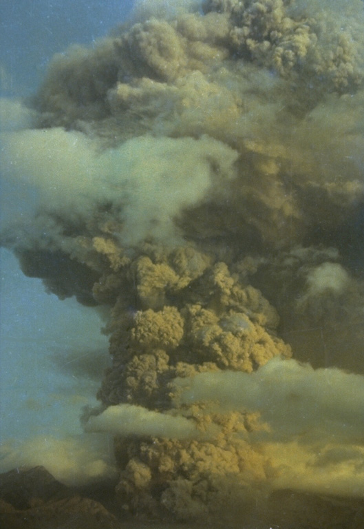 An ash plume rising above Galunggung in October 1982. Intermittent explosive eruptions had taken place since the start of the eruption on 5 April, accompanied by pyroclastic flows and lahars that devastated nearby areas. More than 40,000 people were evacuated during the eruption. Photo by Ruska Hadian, 1982 (Volcanological Survey of Indonesia).