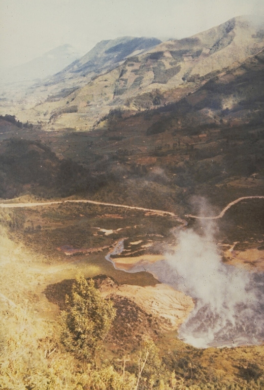 Kawah Sileri is one of many craters in the Dieng volcanic complex that have erupted in historical time. This 1973 photo shows a plume at the crater where a 2-3 minute explosive eruption on 13 December 1964, killed 114 people. Kawah Sileri, located NE of the village of Dieng, is one of the northernmost craters in the Dieng complex. Photo by Sumarma Hamidi, 1973 (Volcanological Survey of Indonesia).