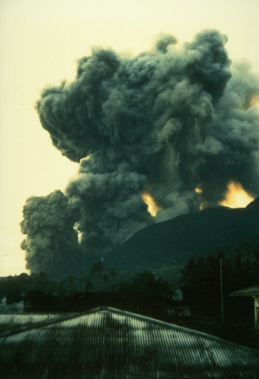 On May 9, 1988, ash columns rise from four eruptive vents along a fissure on the southern flank of Banda Api volcano, observed here from the village of Neira, located across a narrow strait 4.5 km east of the eruptive fissure.  An arcuate N-SSW-trending eruptive fissure cut almost entirely across Gunung Api Island during the first day of the eruption and produced both vigorous explosive activity and lava flows.  Winds distributed ashfall primarily to west, away from Neira Island. Photo by Willem Rohi, 1988 (Volcanological Survey of Indonesia).