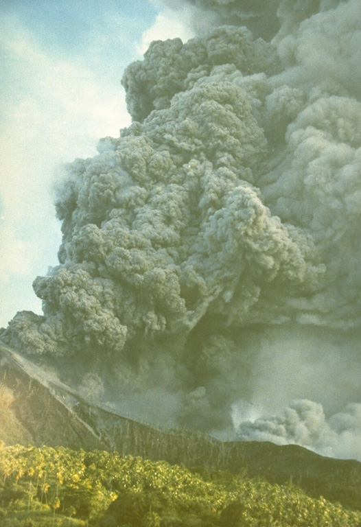 An ash plume rises above Indonesia's Makian volcano in this photo taken on 31 July 1988 from the neighboring Moti Island. The six-day eruption began on 29 July and produced ash plumes that reached 8-10 km altitude. Pyroclastic flows on the 30th reached the coast of the island where 15,000 residents had been evacuated. A lava dome was extruded in the summit crater at the end of the eruption. Photo by Willem Rohi, 1988 (Volcanological Survey of Indonesia).