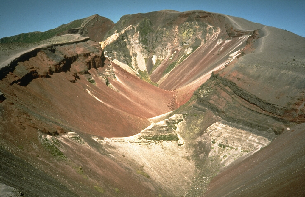 This large fissure produced during a major explosive eruption at Tarawera in 1886 is one of the youngest eruption features of the Okataina Volcanic Centre. Okataina is surrounded by extensive ignimbrite and pyroclastic deposits produced during caldera-forming eruptions. The subparallel NE-SW-trending Haroharo and Tarawera complexes consist of rhyolitic lava domes and associated lava flows that formed between about 15,000 and 800 years ago and impounded lakes against the margins of the Okataina ring structure. Photo by Richard Waitt, 1986 (U.S. Geological Survey).