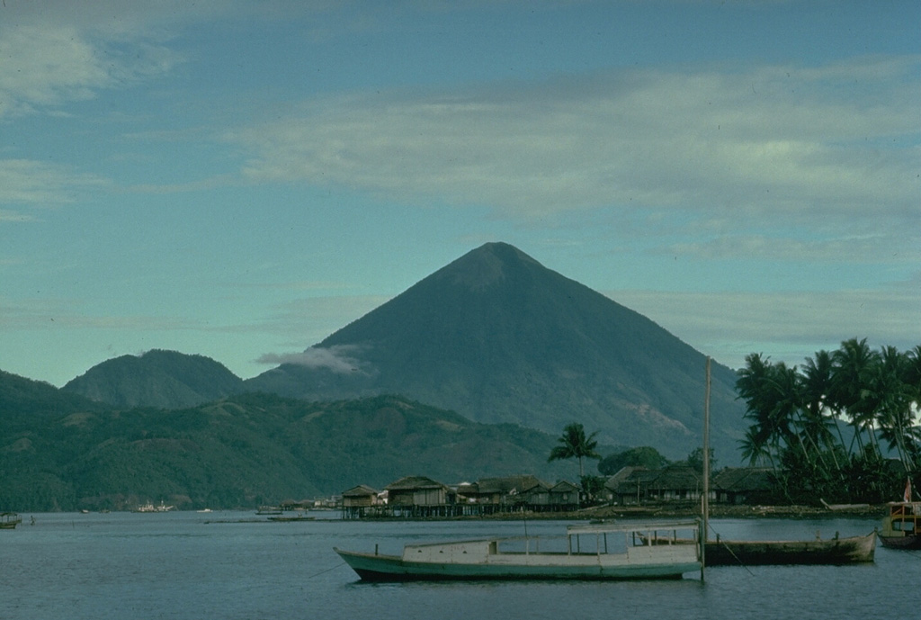 The conical Kie Matabu volcano at the south end of Tidore Island forms the highest peak of the northern Maluku island chain west of Halmahera.  The Telaga volcano at the north end, consists of a caldera (lake, foreground) containing two cones. Copyrighted photo by Katia and Maurice Krafft, 1976.