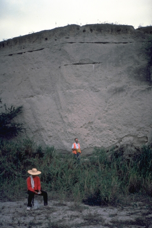 Geologists investigate a thick pyroclastic flow deposit on the ENE side of Parker volcano in southern Mindanao. Preliminary investigation of the eruptive deposits of this volcano revealed many similarities to those of Pinatubo. The flanks of both volcanoes are blanketed with thick pyroclastic flow deposits produced by powerful explosive eruptions. Photo courtesy of Chris Newhall (U.S. Geological Survey).