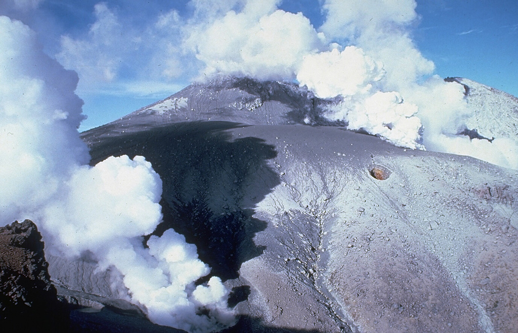 Vigorous steam plumes rise from vents near the summit of Ontake in central Honshu, Japan, on 9 November 1979. The first historical eruption began on 28 October and produced a 1.5-km-high eruption plume with ashfall to the NE. Intense gas-and-steam emissions with minor ash continued for several months. Photo by T. Kobayashi, 1979 (courtesy Tokiko Tiba, National Science Museum).