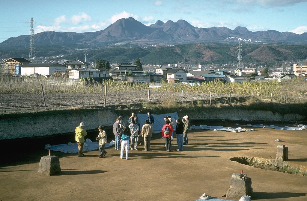 Harunasan volcano has an irregular profile, seen here from an archaeological site to the ENE. The peak to the left-center is Futatsudake lava dome, the source of two large explosive eruptions during the 5th and 6th centuries. Tephra layers from both Harunasan and Asamayama buried structures at the archaeological site. Photo by Tom Simkin, 1993 (Smithsonian Institution).