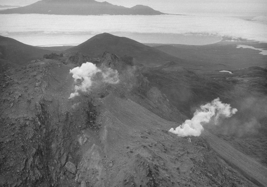 The Etorofu-Yakeyama (Ivan Grozny) volcano group in central Iturup Island contains the historically active Yakeyama (Grozny) andesitic lava dome and several other Holocene domes to the NE. This September 1989 view from the E shows geothermal emissions that began at the time of a minor 1989 eruption on the N flank of the active dome. Photo by A. Samoluk, 1989 (courtesy of Genrich Steinberg, Institute for Marine Geology and Geophysics, Yuzhno-Sakhalinsk).