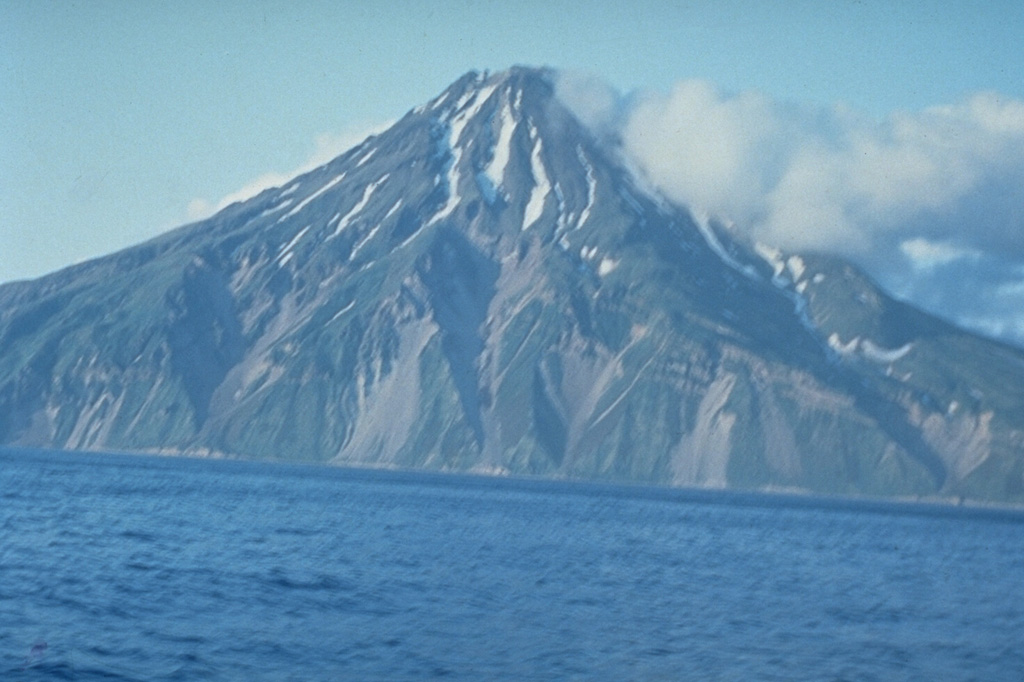 The 3-km-wide island of Shirinki, part of a chain of volcanoes west of the main Kuril Island arc, is located 15 km W of Fuss Peak on Paramushir Island. It has a 750-m-wide summit crater that opens to the south. The crater, not visible in this view from the W, contains two lava domes. Photo by Oleg Volynets (Institute of Volcanology, Petropavlovsk).