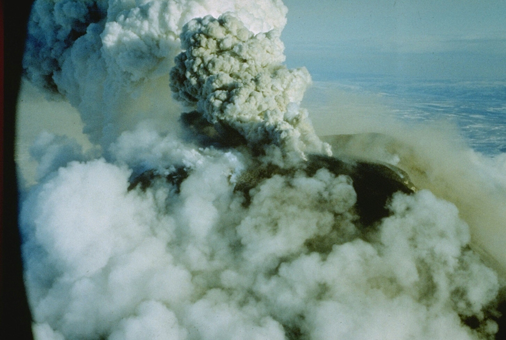 An ash plume rises from the summit crater of Avachinsky on 16 January 1991. An explosive eruption began on 13 January 1991 and produced ash plumes 4-5 km above the crater, resulting in ashfall on Petropavlovsk. During the eruption, lava filled the 260-m-wide summit crater. Small lava flows spilled over the crater rim and advanced 1.5 km down the SSE flank and a short distance down the SW flank. The lava flows melted snow to form small lahars down the S flank. Photo by Oleg Volynets, 1991 (Institute of Volcanology, Petropavlovsk).