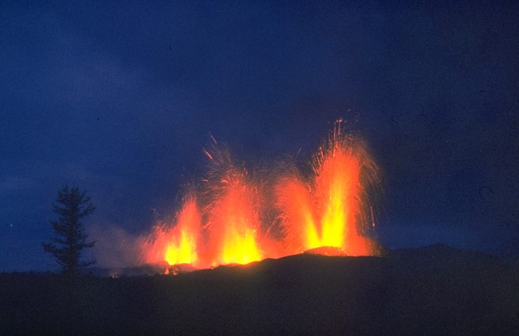 Lava fountains erupt on 20 September 1975, two days after the continuation of activity 10 km south of the earlier activity at the northern end of the Tolbachik eruptive fissure. Activity at the southern end was dominantly effusive, and lasted 15 months, much longer than the three-month-long activity at the northern end. Photo by Oleg Volynets, 1975 (Institute of Volcanology, Petropavlovsk).