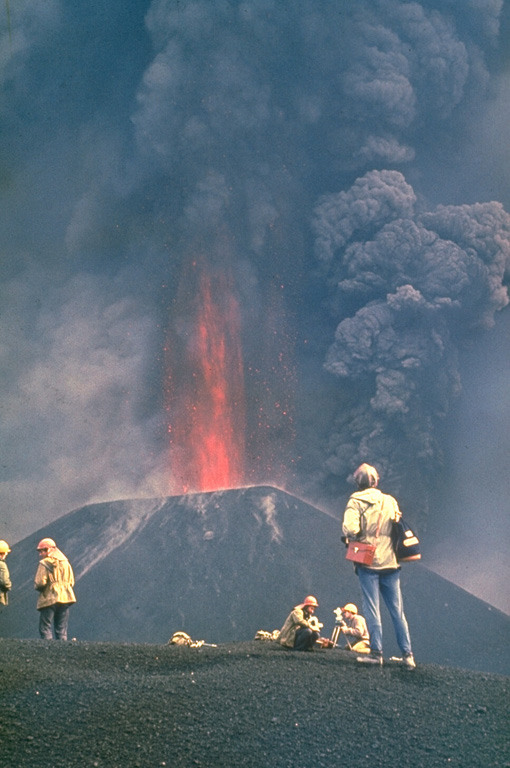 Ash plumes and incandescent lava fragments are ejected from a new scoria cone in 1975. Following minor ash eruptions from the Plosky Tolbachik summit crater on 28 June, the "Great Tolbachik Fissure Eruption" began 18 km S of the summit on 6 July, producing a major eruption that lasted until 15 September. A dominantly effusive eruption began 28 km S of the summit on 18 September and continued until December 1976.  Photo by Yuri Doubik, 1975 (Institute of Volcanology, Petropavlovsk).