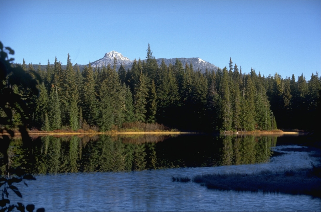 Lemei Rock, seen from the Forlorn Lakes to the SE, forms the high point of the Indian Heaven volcanic field midway between Mount St. Helens and Mount Adams. The 600 km2 field consists of overlapping small shield volcanoes with smaller cones and lava flows. The field was active from about 730,000 to about 9,000 years ago and contains some volcanic features that originated beneath a glacial icecap. Photo by Lee Siebert, 1995 (Smithsonian Institution).