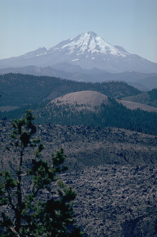 Mount Shasta one of the largest volcanoes of the Cascade Range, is located in northern California at the southern end of the Cascades. It is seen here beyond the Little Glass Mountain obsidian flow from Medicine Lake volcano to the NE. Photo by Lee Siebert, 1981 (Smithsonian Institution).