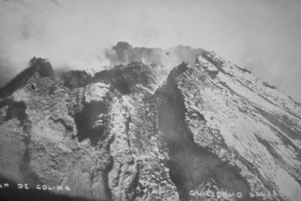 By the time that this 7 June 1960 photo was taken at Colima, the lava dome had risen to the height of the crater rim. The dome had begun growing again in May 1957 after about 25 years of quiescence, from a depth about 50 m below the notch in the northern crater rim (center) known as La Gran Vena. In 1961 this dome growth resulted in lava flowing out of the crater through this notch and down the northern flank. Photo by Guillermo Saucedo, 1958 (courtesy Julian Flores, University of Guadalajara).