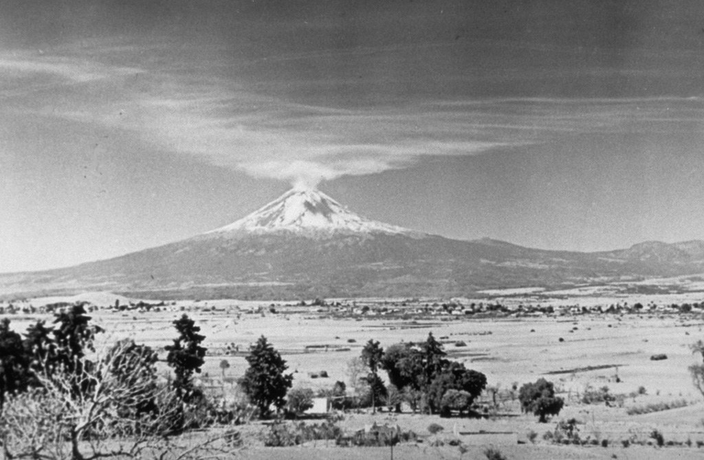 Gas emissions from the summit crater of Popocatépetl volcano on 18 January 1947 are dispersed towards Tonantzintla 40 km away. Brief explosions in January and February 1947 ejected ash and steam. Ash affected the Schmidt camera mechanism at the Tonantzintla Astrophysical Observatory. During interviews in 1989, tribal elders recalled the explosions and seismicity in 1947. This was last known activity at Popocatépetl before an eruption in 1994. Photo by Juan Presno, 1947 (courtesy of E. Chavira, INAOE).