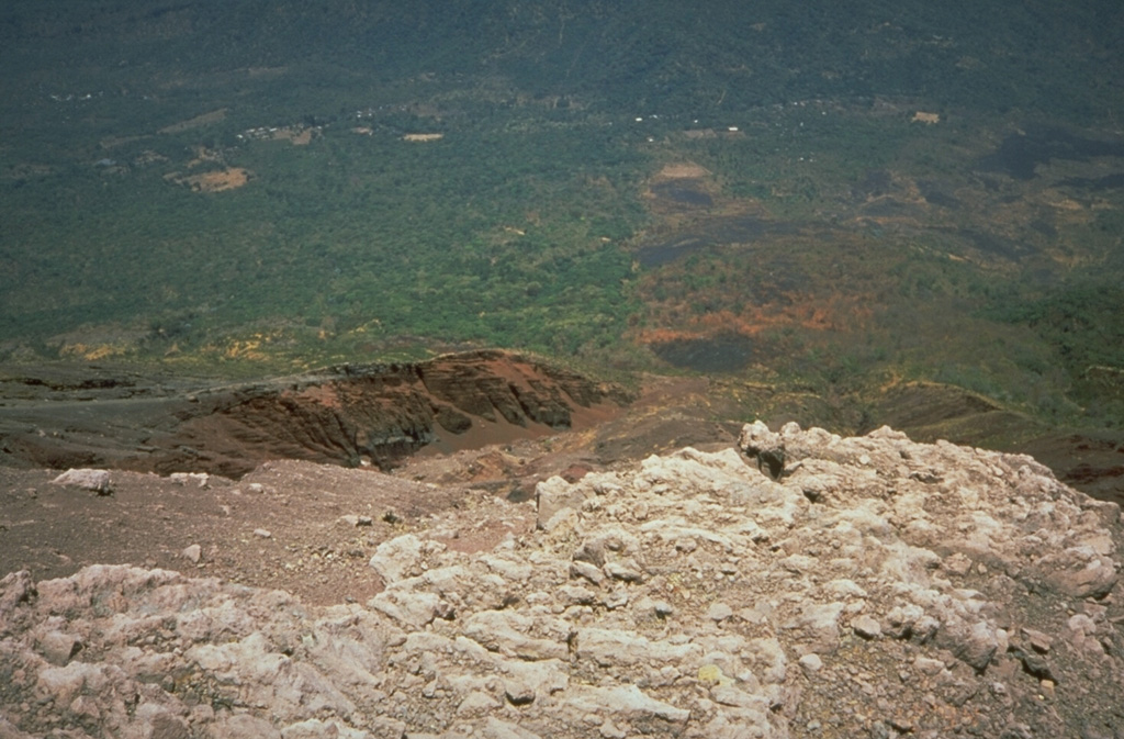 The fresh-looking lava flow at the upper right on the north flank of San Miguel volcano was emplaced during an eruption in 1844.  The flow originated on July 25 from a NNW-flank fissure and traveled initially to the NNW before diverting to the NE and reaching to 8 km from the summit.  After December the volcano began long-term explosive activity that lasted until 1848, when another lava flow occurred. Photo by Kristal Dorion, 1994 (U.S. Geological Survey).