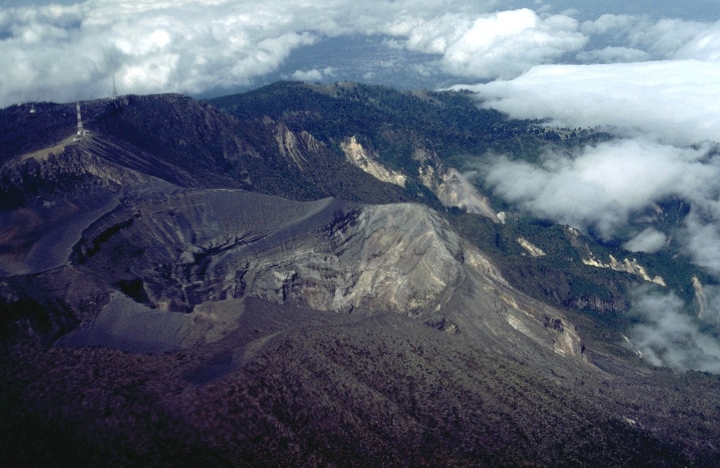 This view from the east shows the active 600-m-wide crater that has been the site of most of Irazú's historical eruptions. The smaller, shallow crater to the lower left is the Diego de la Haya crater.  Photo by William Melson, 1986 (Smithsonian Institution).