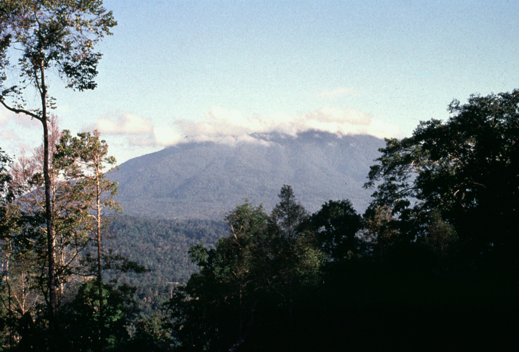 Gunung Lubukraya, seen here from the north, is latest Pleistocene to possibly Holocene age. A broad crater is breached to the south, and a prominent lava dome is on the southern flank of the volcano. Anonymous, 1991.