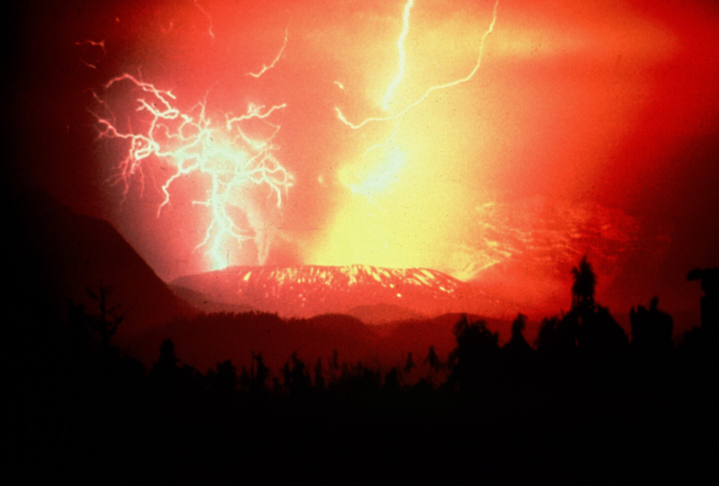 Volcanic lightning produced during a Strombolian eruption at Galunggung volcano on 3 December 1982. Incandescent bombs deposited on the outer eastern flanks of the Warirang crater. Late in the 1982-83 eruption Strombolian activity constructed a scoria cone within the crater. Anonymous, 1982.