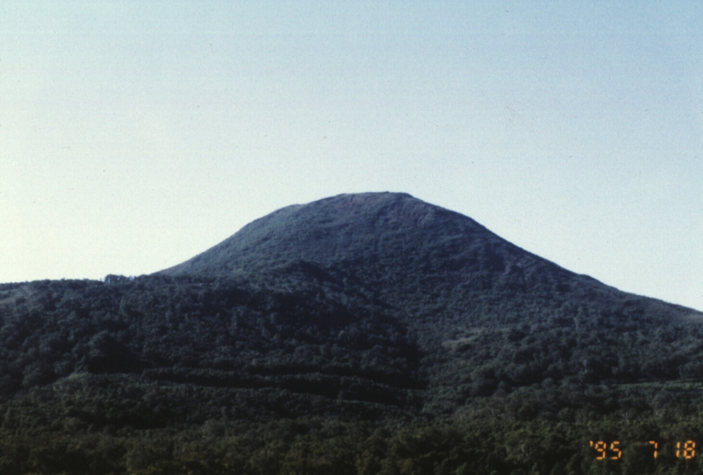 Chisenupuri volcano, seen here from the SE, is a lava dome that overlies the massive lava flow to the left. It is part of the Niseko volcano group, a cluster of small cones and lava domes. Photo by Yutaka Kodama, 1995 (Hokkaido University).
