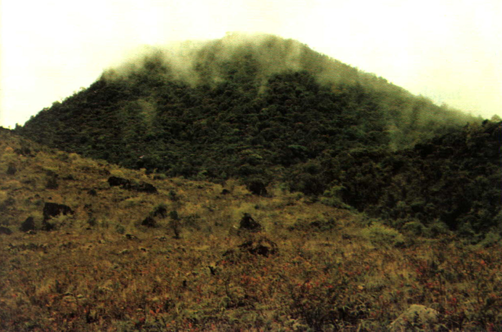 Thin clouds drape one the peaks of Peuet Sague volcano in NW Sumatra. The first recorded historical eruption took place during 1918-21, when explosive activity and pyroclastic flows accompanied lava dome growth. Photo by Sumarma Hamidi, 1975 (Volcanological Survey of Indonesia).