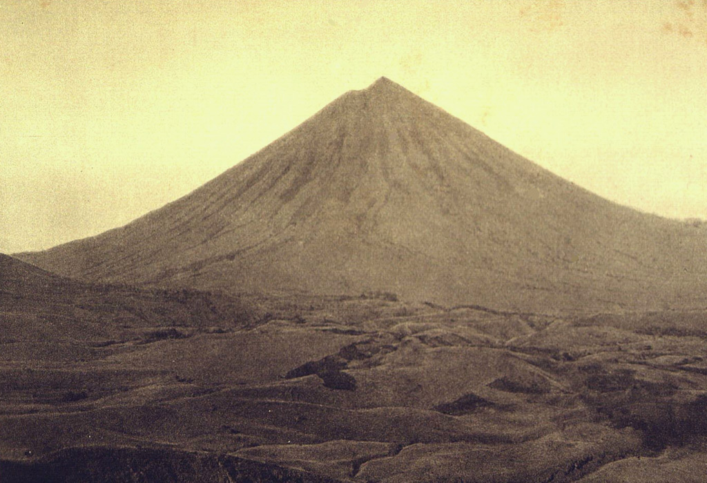Inierie, the highest volcano on Flores Island, rises above hilly terrain of the central highlands below its northern flank. It has an elliptical crater immediately E of its summit that occasionally produces plumes. Photo by E. Weissenborn (published in Kemmerling 1929, 