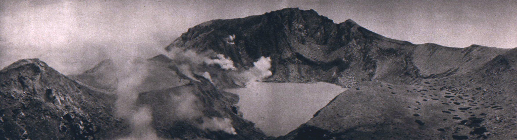 Fumaroles line the walls of the summit crater of Egon. A lake occupies the floor of the crater in this 1920's view from the southern crater rim. The northern crater rim marks the summit of the volcano. Photo published in Kemmerling 1929, 
