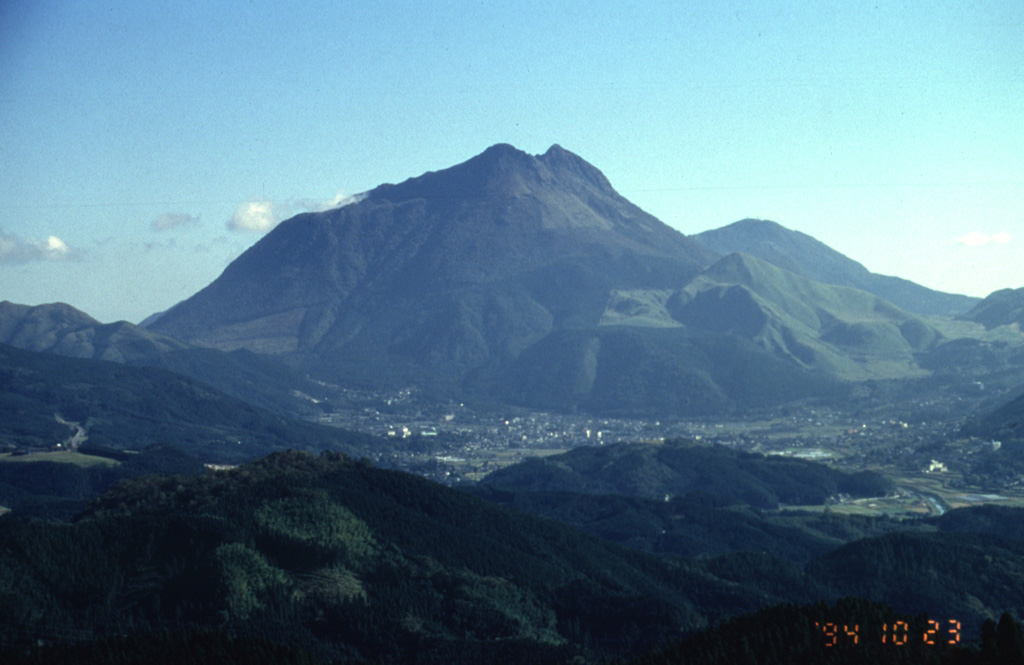 Yufudake, the westernmost of the two large lava dome complexes of Tsurumi volcano, rises to the NE of the city of Yufu in northern Kyushu. Three smaller lava domes are located on the N flank of the eastern dome. A historical eruption occurred in 867 CE. Photo by Yukio Hayakawa, 1994 (Gunma University).