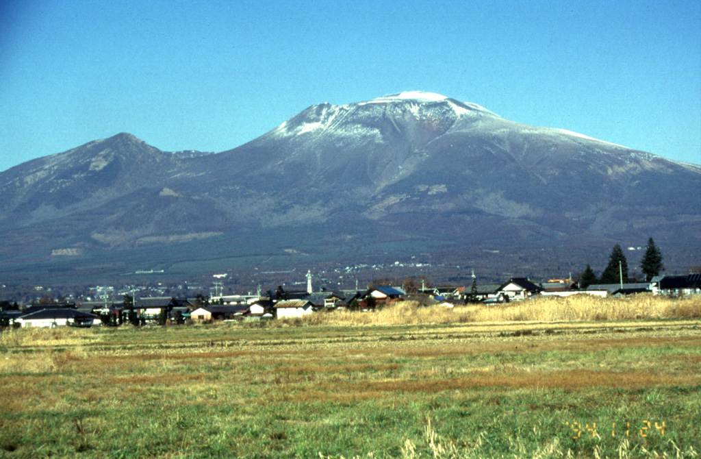Asama, one of Honshu's most active volcanoes, is seen here from the SE. The snow-capped modern cone of Maekakeyama (center) was constructed within an open collapse scar resulting from the failure of Kurofuyama, an older cone forming the lower peak to the left. The E-facing escarpment of Kurofuyama was created by a large volcanic landslide about 20,000 years ago. Maekakeyama is probably only a few thousand years old, but has had several major Plinian eruptions, two of which occurred in 1108 and 1783 CE. Photo by Yukio Hayakawa, 1998 (Gunma University).
