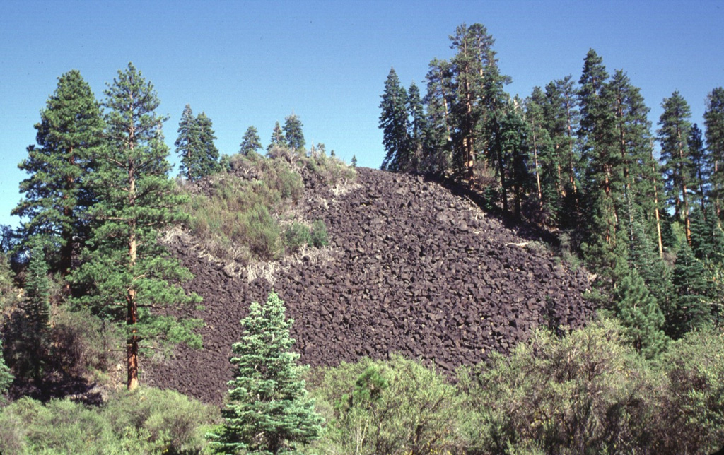 This steep-sided blocky lava flow originated from Potato Butte, twin cinder cones located immediately north of Lassen Volcanic National Park.  The lava flows originated from vents that overlie the western side of the Hat Creek valley and traveled primarily to the north and west of the cones.  The flows, once thought to be of possible Holocene age, have been dated at 65,000-75,000 years old. Photo by Lee Siebert, 1998 (Smithsonian Institution).