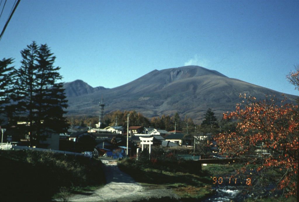 A faint plume rises above the summit of Asama behing the resort city of Karuizawa, immediately SE of the volcano. Asama is one of the most active volcanoes in Honshu and ash from its eruptions occasionally reach Tokyo. Photo by Yukio Hayakawa, 1990 (Gunma University).