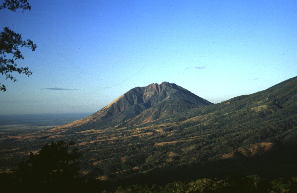 A large 1.3 km wide valley on the eastern flank of Usulután volcano is seen here from the flanks of Chinameca to its NE, with the Pacific Ocean in the distance to the left.  Photo by Carlos Pullinger, 1996 (Servicio Nacional de Estudios Territoriales, El Salvador).