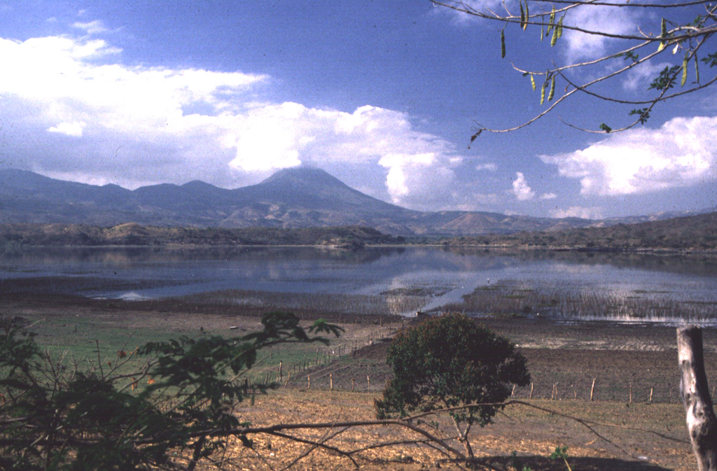 The largest peak on the El Salvador/Guatemala border is Volcán Chingo, seen here from the SW on the shores of Laguna de Llano on the Salvador side of the border. Photo by Giuseppina Kysar, 1999 (Smithsonian Institution).