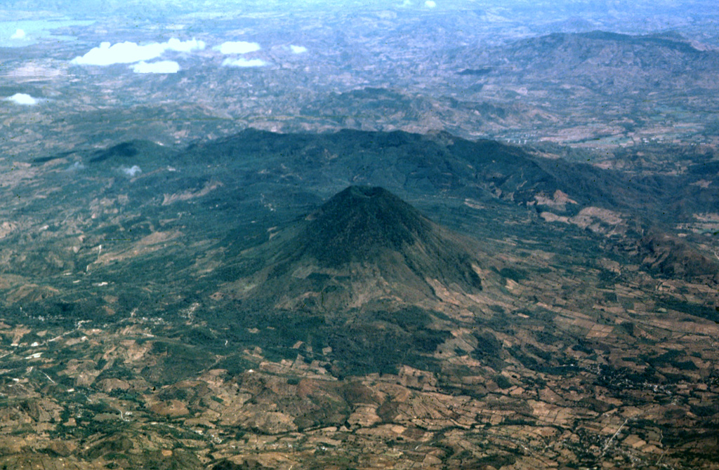 Volcán Chingo is located along the Guatemala/El Salvador border. This aerial view is from the SW, the Guatemala side. The border with El Salvador extends from the bottom-right part of the photo through Volcán Chingo to Lake Guija at the upper left corner of the photo. Photo by Paul Kimberly, 1999 (Smithsonian Institution).