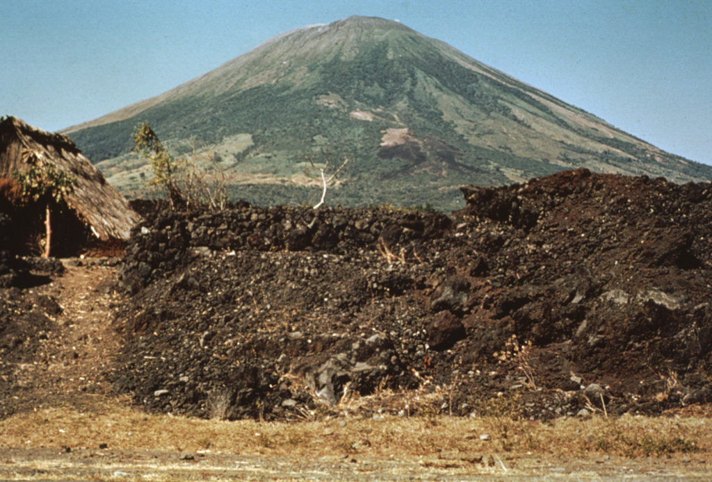 This barren lava flow issued from a fissure vent on the SE flank of San Miguel in 1819.  The flow traveled about 5 km and covered a broad area below the SE base of the volcano, extending down to 25 m above sea level.  Emplacement of the lava flow necessitated the construction of a new road at the base of the volcano. Photo by Dick Stoiber, 1971 (courtesy of Bill Rose, Michigan Technological University).