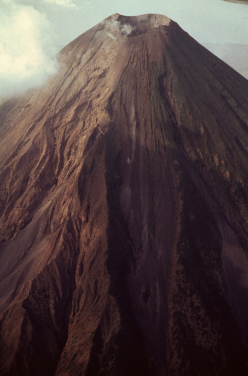 More than 40 individual lava flows are visible on Concepción's flanks and frequent eruptions have substantially modified the summit region. Much of the upper cone, including the south side flank here, remains unvegetated and has undergone extensive erosion Photo by Jaime Incer, 1994.