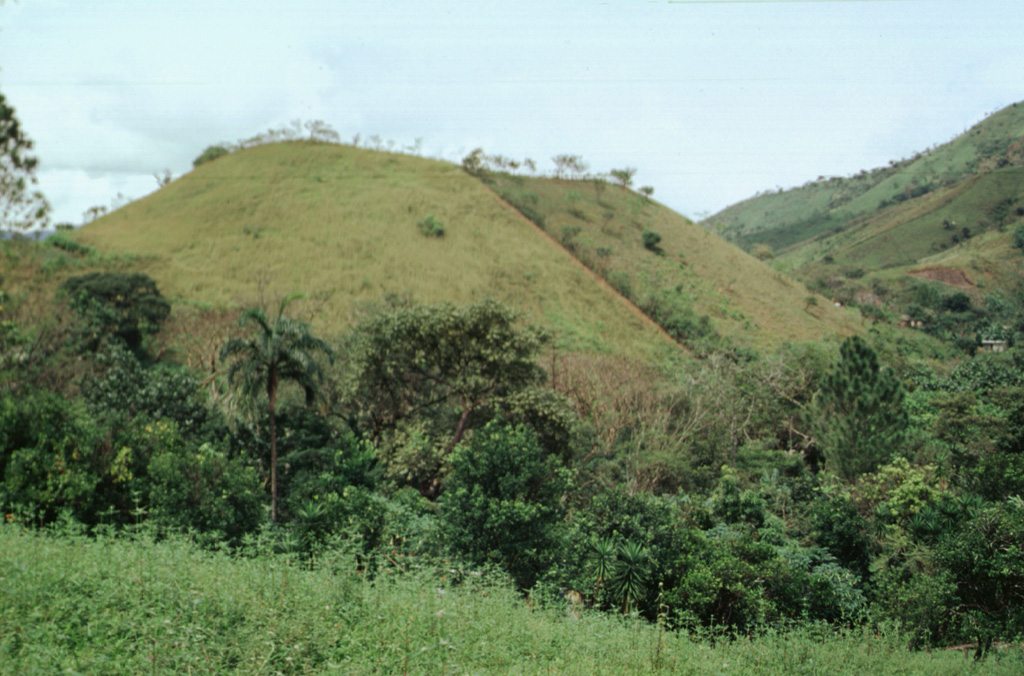 The Media Luna scoria cone at the NW side of La Yeguada volcanic complex is one of its youngest features. A lava flow that erupted from the western flank reached about 3 km to the west. A radiocarbon date of 360 +/- 90 years before present (BP) was obtained from lake sediment formed when the lava flow blocked a local drainage.  Photo by Paul Kimberly, 1998 (Smithsonian Institution).