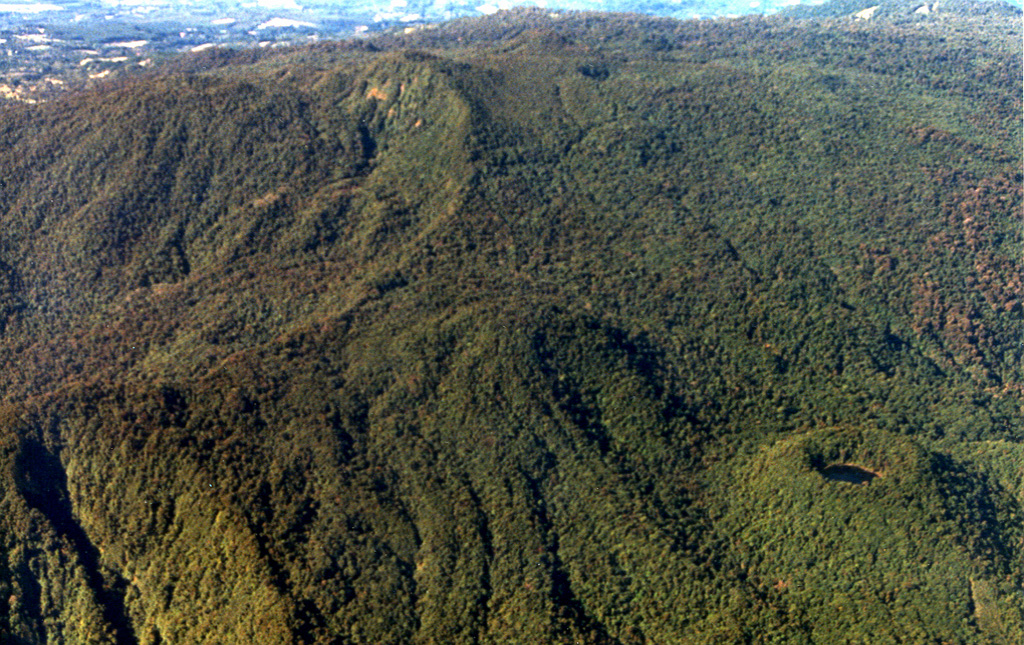 The summit area of Volcán Barva is composed of a series of overlapping cones with about a dozen vents. At the lower right is Danta cone with a small crater lake. Forest-covered lava flows can be seen to its left. Barva is the topographic high point of Braulio Carillo National Park. Photo by Federico Chavarria Kopper, 1999 (courtesy of Eduardo Malavassi, OVSICORI-UNA).