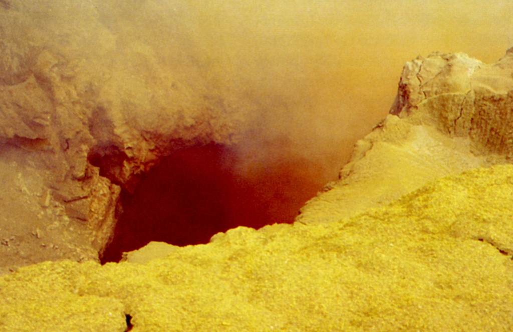 Yellow sulfur and other minerals precipitate around high-temperature fumaroles in the Poás summit crater. Fumarole temperatures approaching 600°C were recorded in 1988, several times higher than the melting point of sulfur. The ejection of sulfur clasts as well as small sulfur flows have been documented during several eruptions at Poás. Photo by Jorge Barquero (Universidad Nacional Costa Rica).