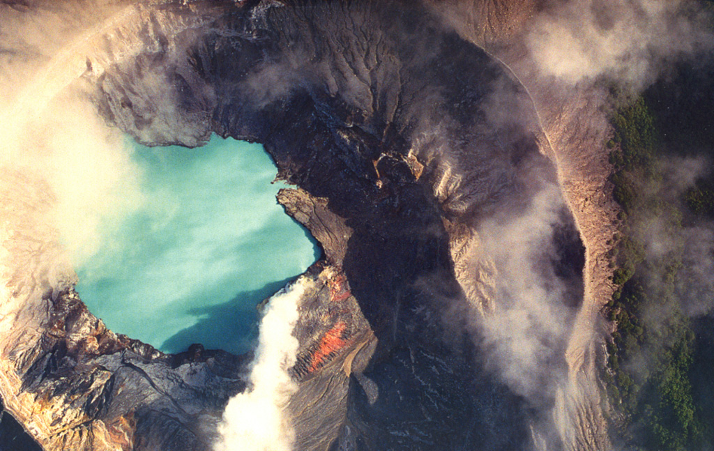A vertical view into the crater lake of Poás volcano in December 1999 shows a gas plume (bottom center) originating from a vent in the south side of the lake. December plume heights ranged between 0.7 and 1 km. The 800-m-wide crater contains an acidic lake.  Photo by Federico Chavarria Kopper, 2000.