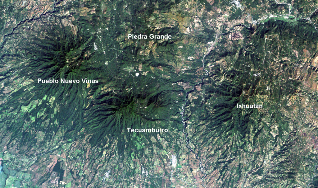 Four large Pleistocene volcanic complexes are visible in this Landsat image of southern Guatemala, with the Pacific coastal plain at the bottom.  Minor activity at Tecuamburro volcano continued into the Holocene at Laguna Ixpaco, the small circular white dot a little more than half-way between the Tecuamburro and Piedra Grande labels.  The Río los Esclavos extends from the upper right, cutting between Tecuamburro and Ixhuatán volcanoes. NASA Landsat image, 2000 (courtesy of Loren Siebert, University of Akron).